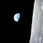 Earthrise as seen from Apollo 8, showcasing the Earth rising above the lunar horizon during the first crewed mission to orbit the Moon.