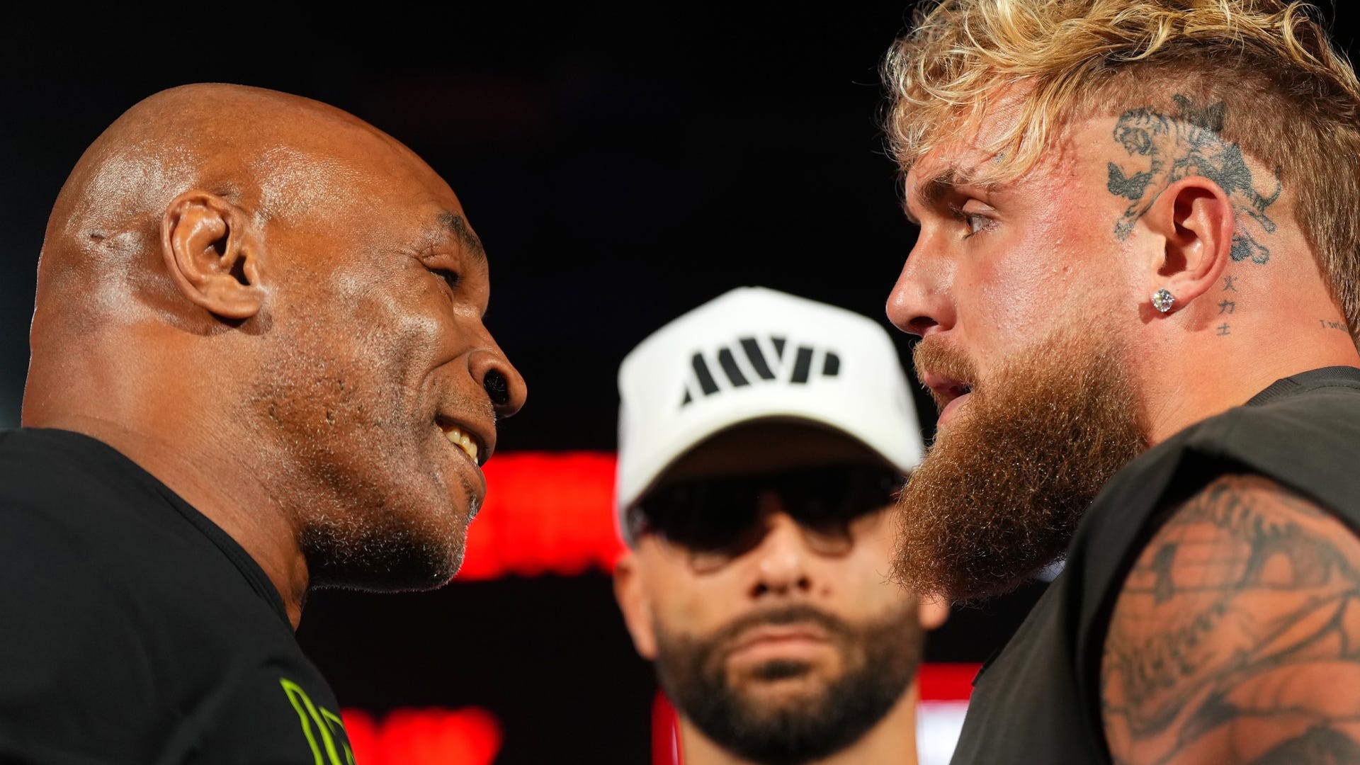 Jake Paul and Mike Tyson face off, highlighting the age difference between the two boxers