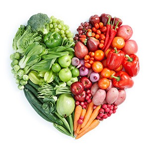 A vibrant display of anti-inflammatory foods including colorful fruits, leafy green vegetables, nuts, and olive oil, highlighting dietary choices for reducing body inflammation.