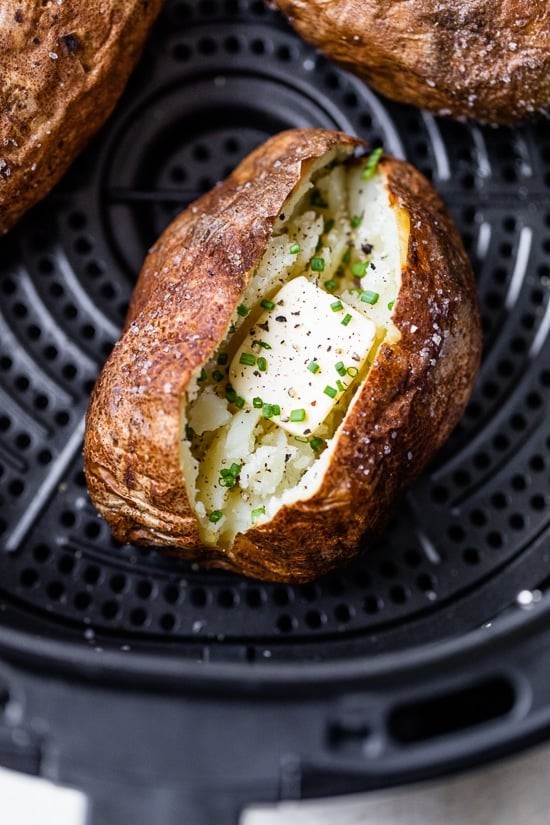 Perfectly cooked air fryer baked potato with fluffy inside