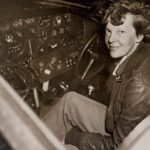 Amelia Earhart in the cockpit of her Lockheed Electra aircraft, the plane she flew on her attempted round-the-world flight in 1937.