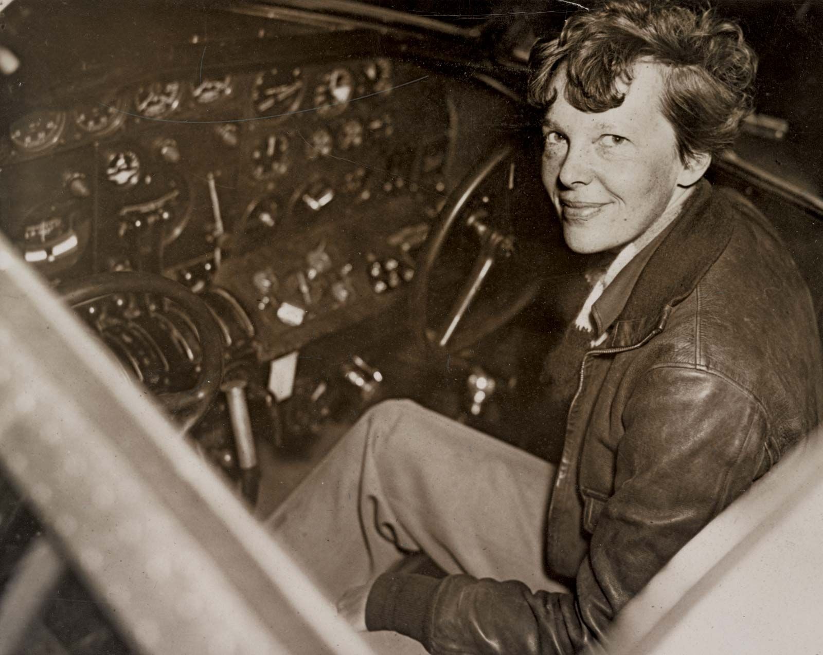 Amelia Earhart in the cockpit of her Lockheed Electra aircraft, the plane she flew on her attempted round-the-world flight in 1937.