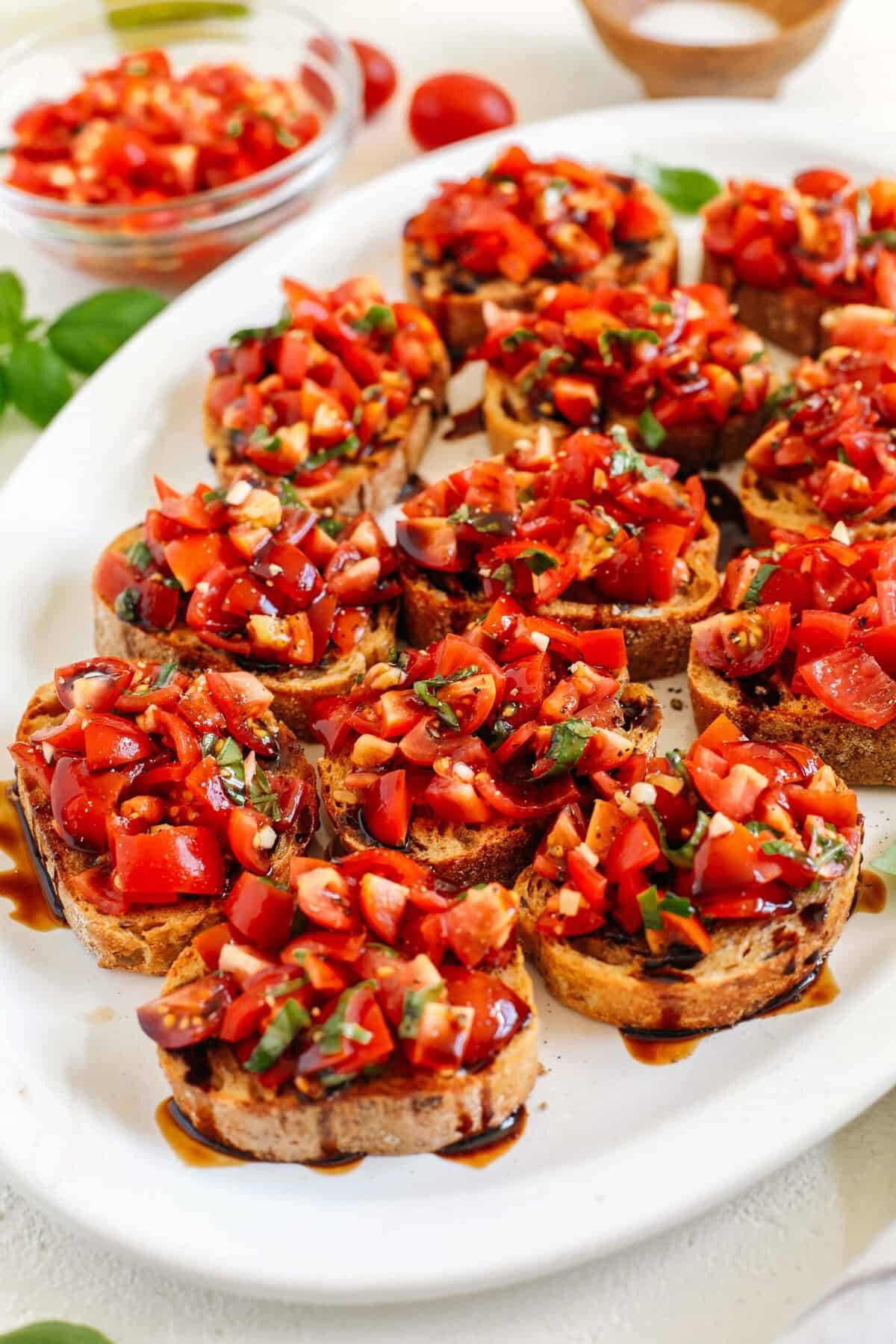 Close-up of fresh tomato and basil bruschetta, showcasing vibrant colors and textures.