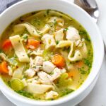 A comforting bowl of homemade chicken noodle soup with rich broth and egg noodles.