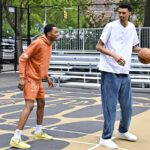 Victor Wembanyama and Bilal Coulibaly at Rucker Park, highlighting Wembanyama's exceptional height as he prepares to become the NBA's second tallest player.