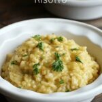 bowl of parmesan risotto topped with fresh parsley