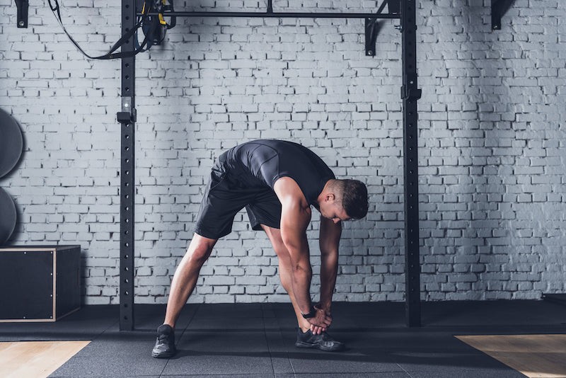 Person preparing for workout with creatine