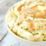 bowl of mashed potatoes with gravy on top