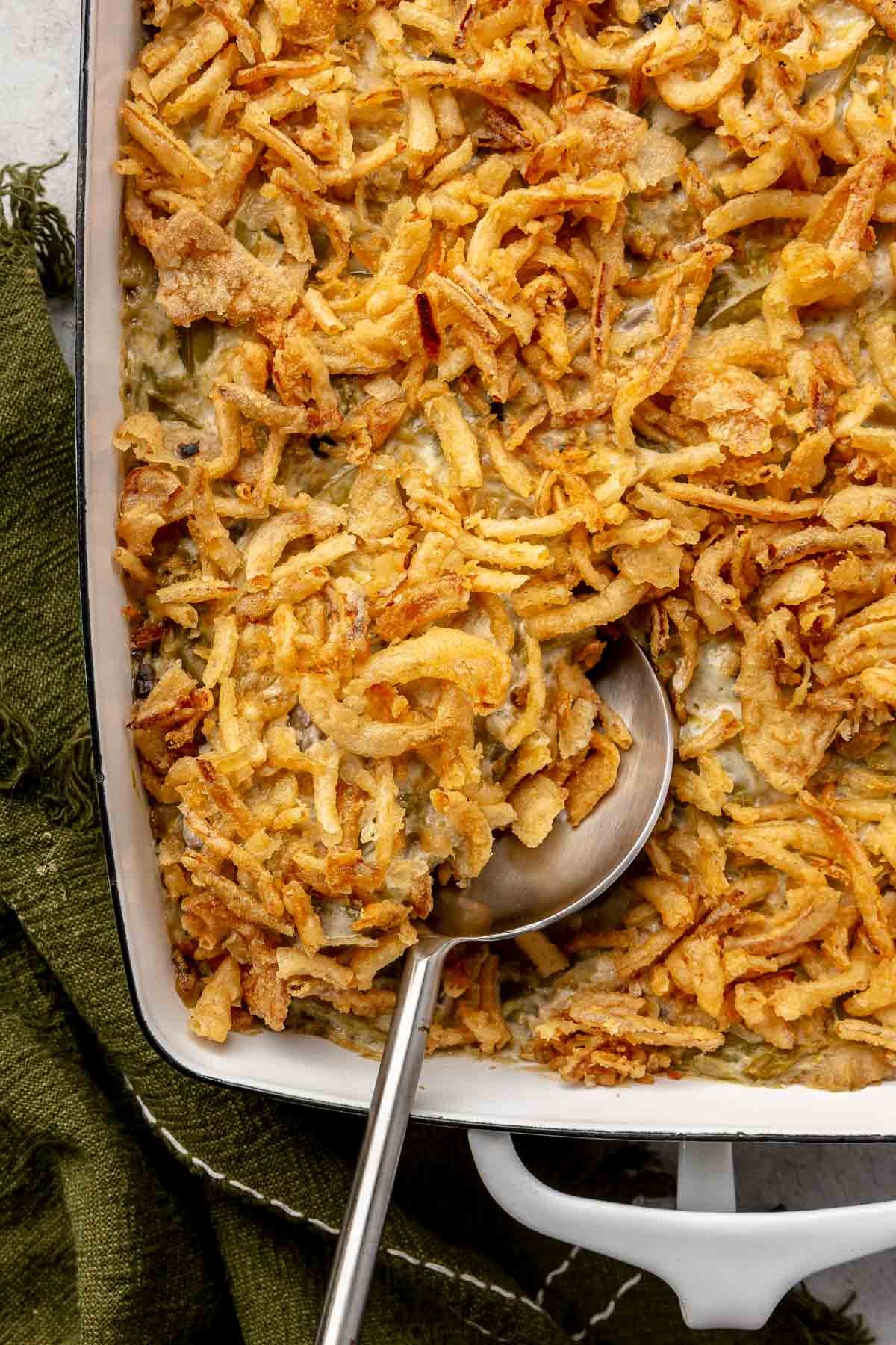 Classic green bean casserole with golden brown crispy onions on top.