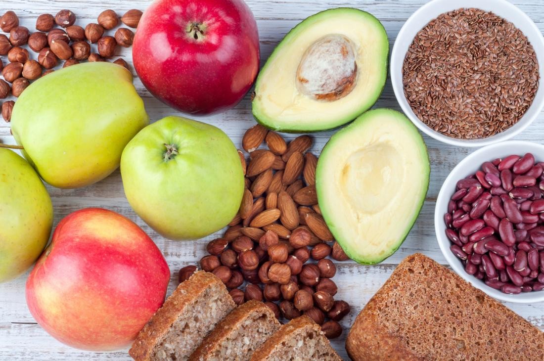 Plant foods that are sources of fibre, including apples, legumes, and whole grains, may aid healthy digestion.