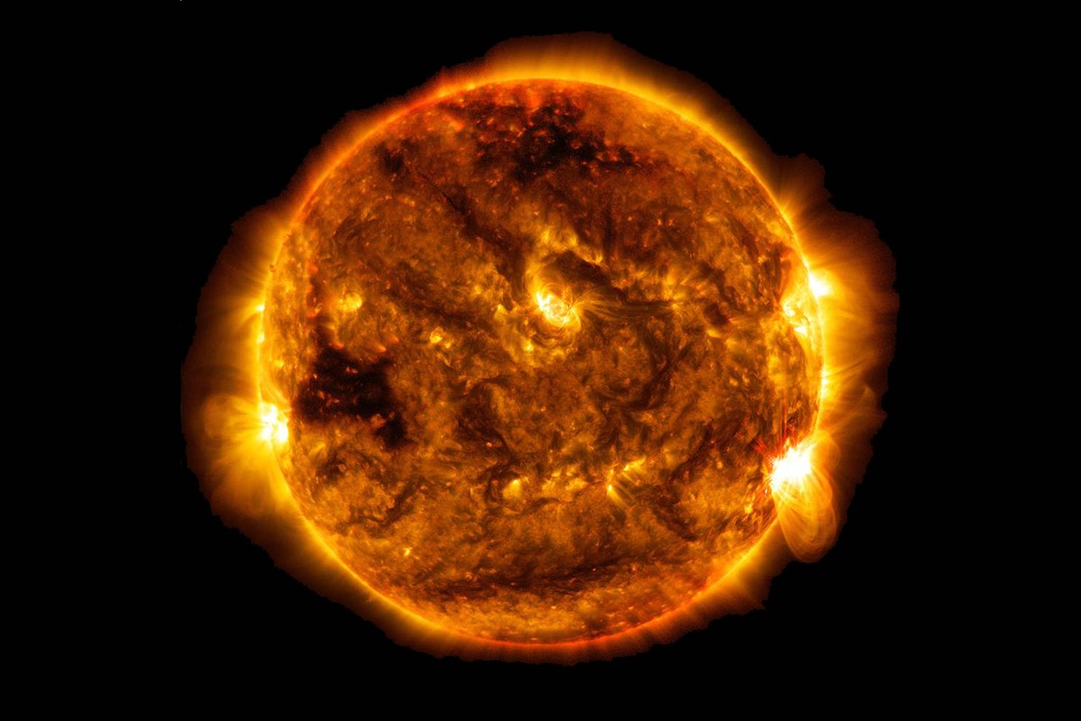 NASA SDO image of the Sun showcasing its immense size relative to Earth, illustrating the concept of how many Earths can fit inside the Sun.