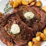 Steak cooked in the oven on a plate.