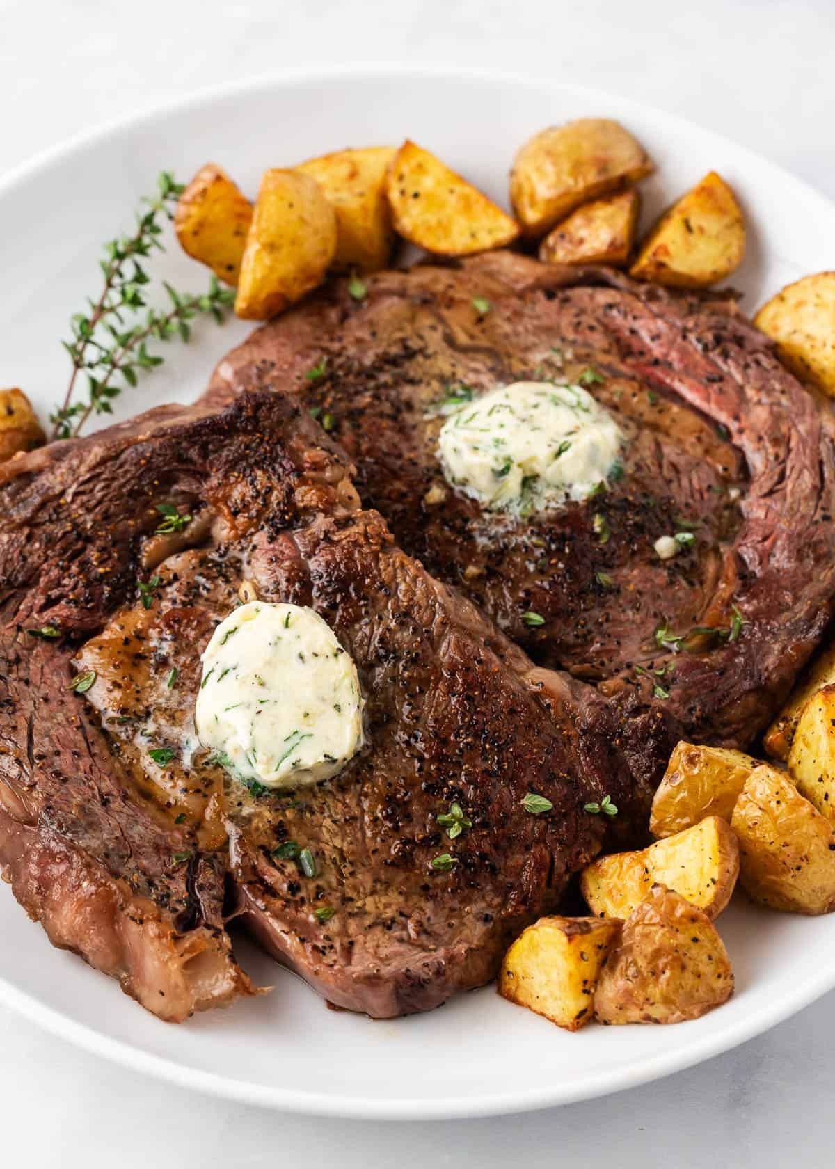 Steak cooked in the oven on a plate.