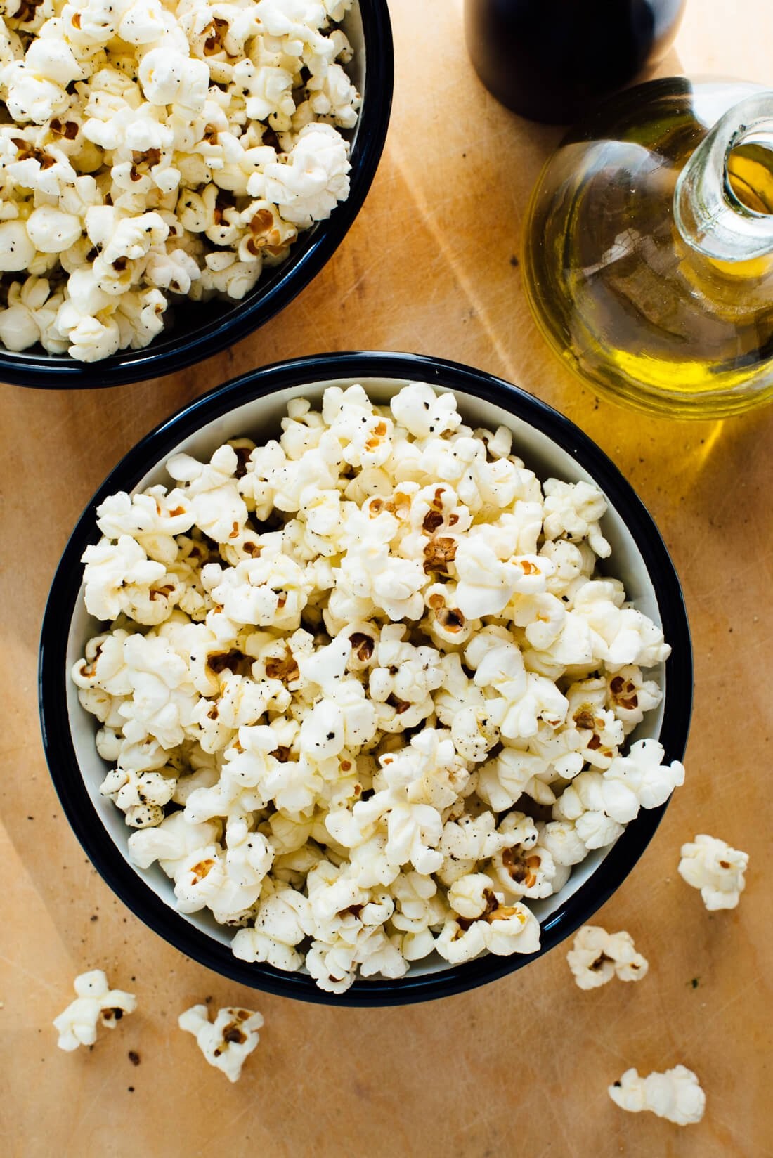 Close-up of popcorn popping in a pot on the stove, demonstrating how to make popcorn on the stove.