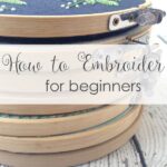 Embroidery supplies for beginners including fabric, thread, needles, hoop, and tracing pen