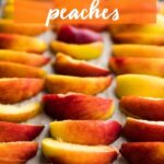 How to Freeze Peaches: neatly arranged peach slices on a baking sheet ready for freezing