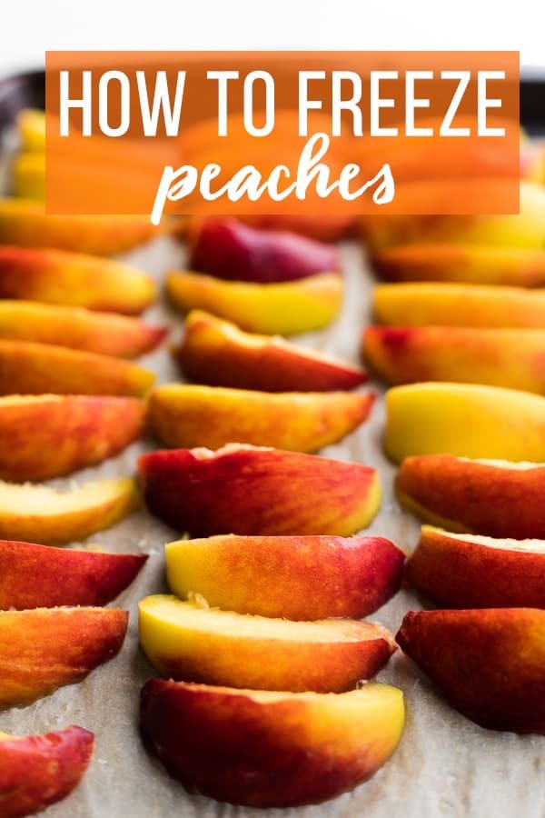 How to Freeze Peaches: neatly arranged peach slices on a baking sheet ready for freezing