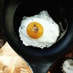 Fried Egg with salt and pepper in Pan