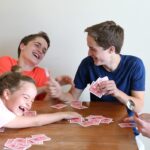 kids laughing playing spoons card game