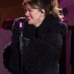 Kelly Clarkson performing at the Rockefeller Center Tree Lighting Ceremony in December 2024, showcasing her public appearances amidst her health journey.