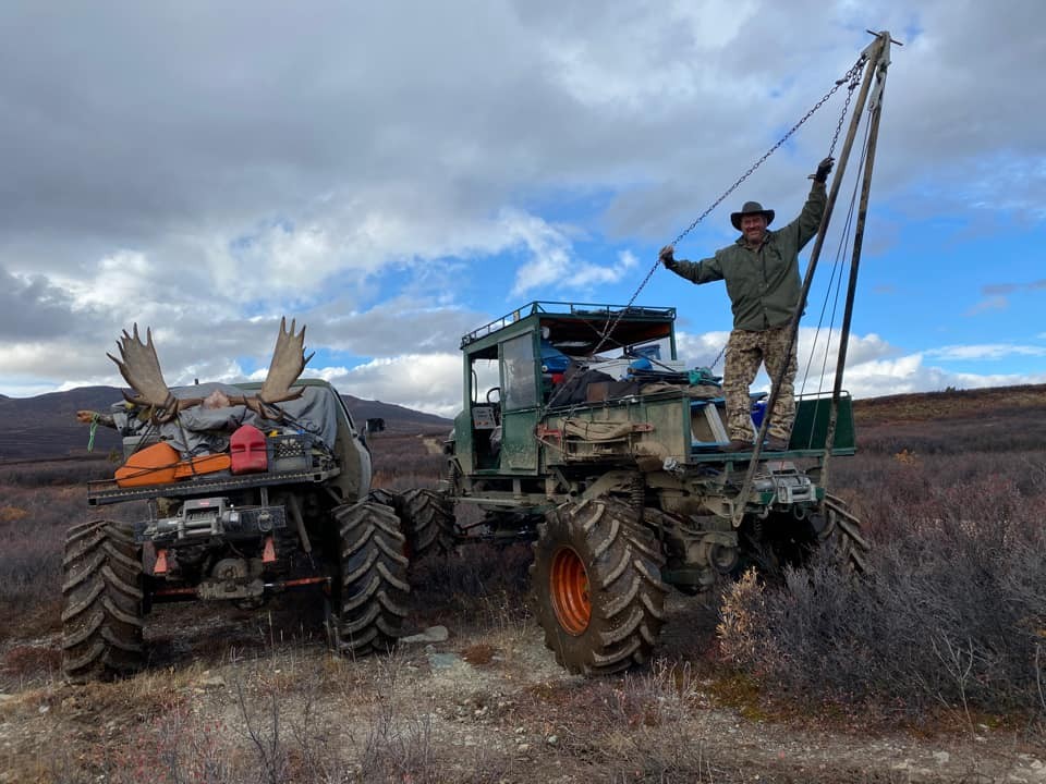 Hunter with moose in British Columbia