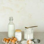 bottles of milk with eggs and flour.