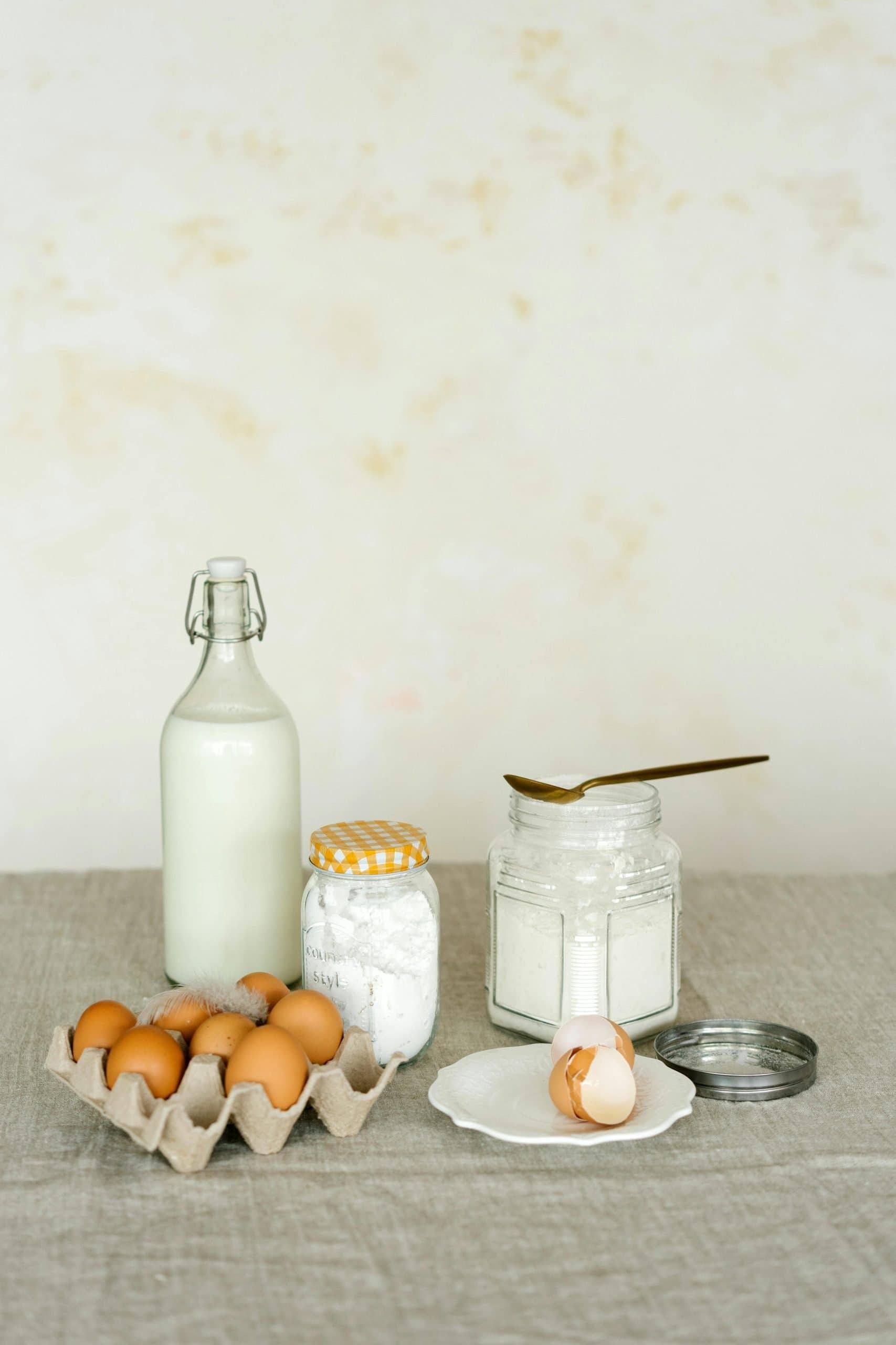 bottles of milk with eggs and flour.