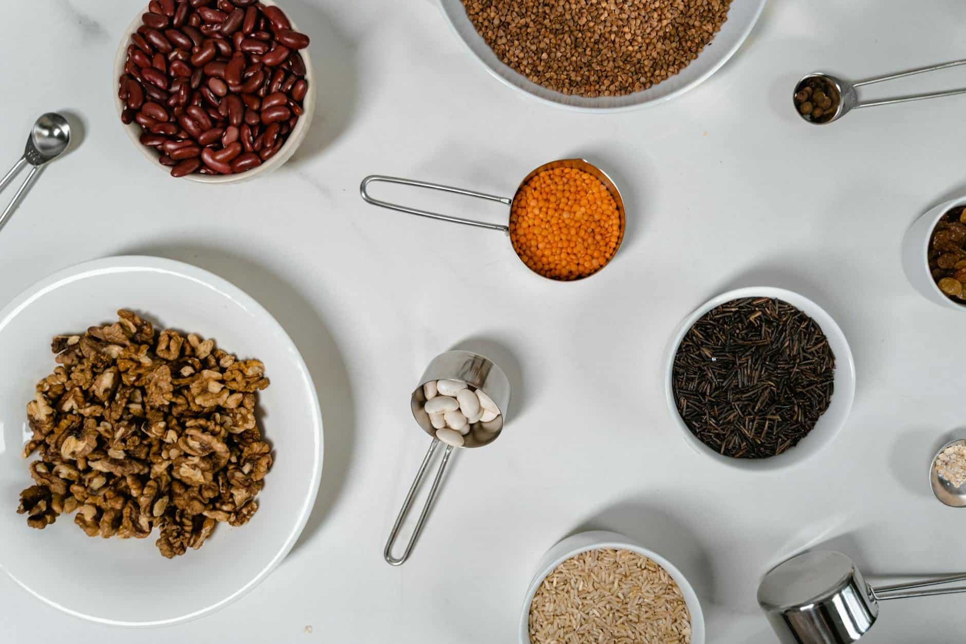 Assortment of vibrant spices and dried goods in bowls, enhancing culinary creations