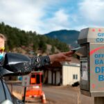 Steph Smith drops off her ballot for the 2020 presidential election in Rollinsville, Colorado, highlighting the accessible voting process and citizen participation.