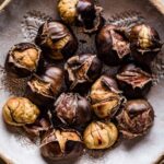 Roasted chestnuts in a bowl from top view