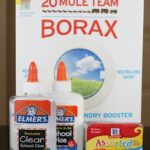 Ingredients for making slime: borax powder, water, Elmer's glue, and food coloring