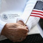 Naturalization Ceremony in Chicago: A group of immigrants becoming U.S. citizens, reflecting the significant increase in the immigrant population in 2023.