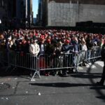 Supporters of former US president and Republican presidential candidate Donald Trump arrive for a campaign rally at Madison Square Garden in New York on October 27, 2024.