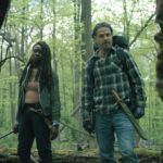 Michonne and Rick Grimes stand armed in a forest in The Walking Dead: The Ones Who Live