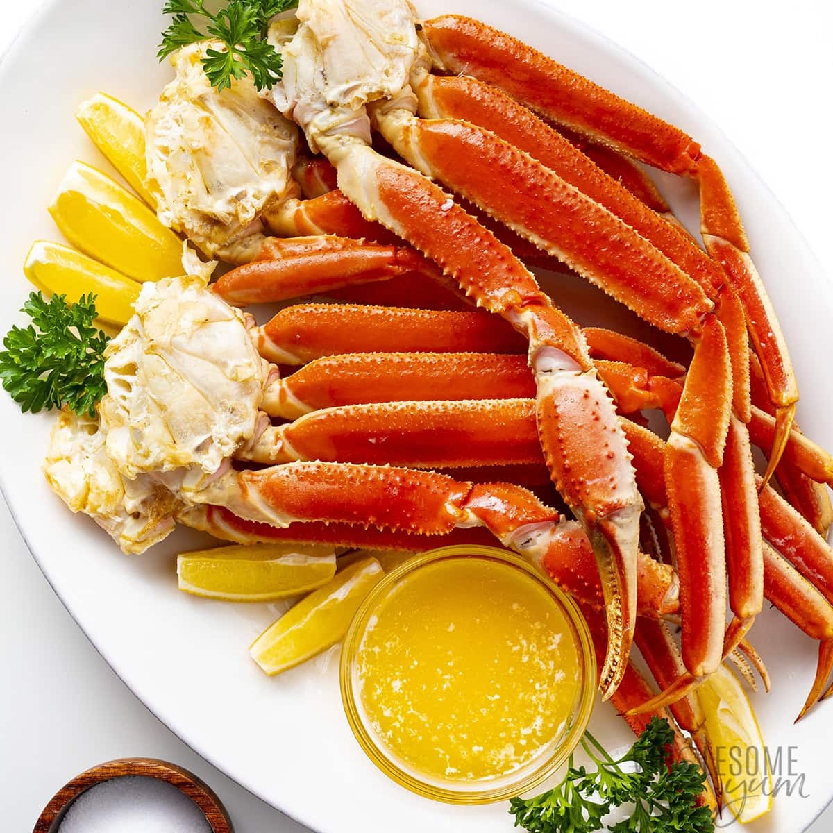 Cooked crab legs on a platter.