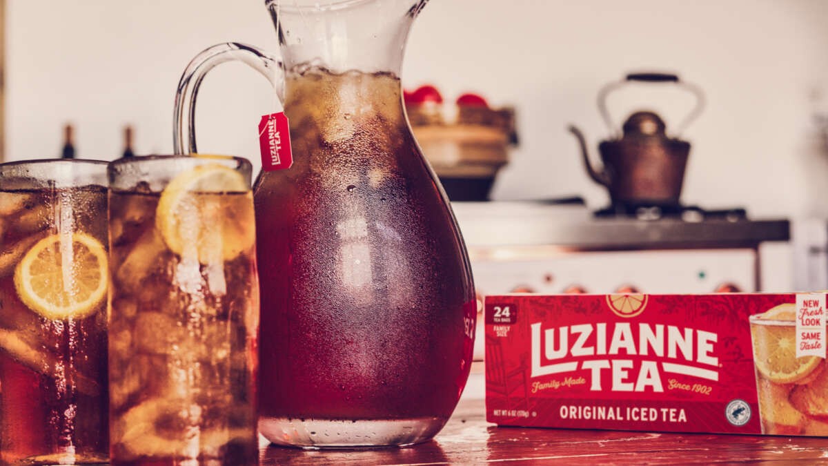 Refreshing pitcher of Luzianne iced tea served in glasses, perfect for family gatherings.