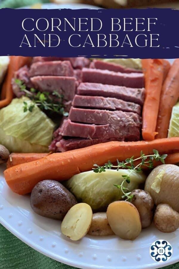 White platter filled with beef, cabbage, potatoes, and carrots, demonstrating the finished corned beef dish.