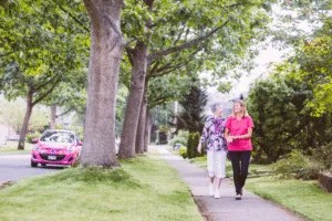 Elderly Caregiver Walking with Client