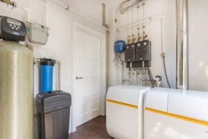 Technician inspecting gas lines for a tankless water heater