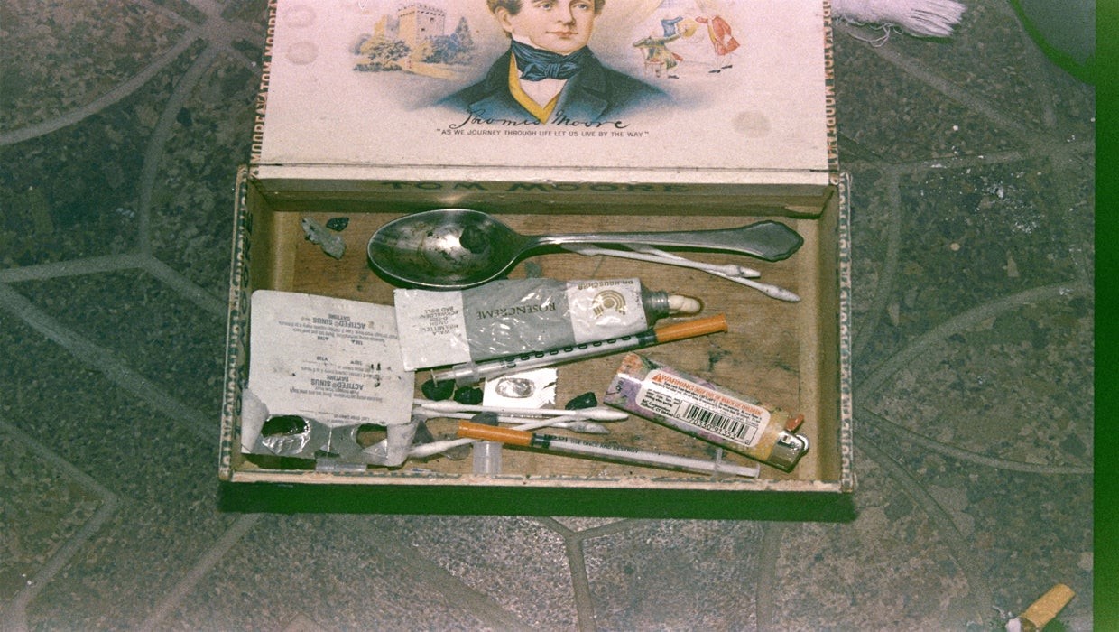This police photo shows Cobain's heroin kit complete with syringes and other paraphernalia kept in a cigar box.