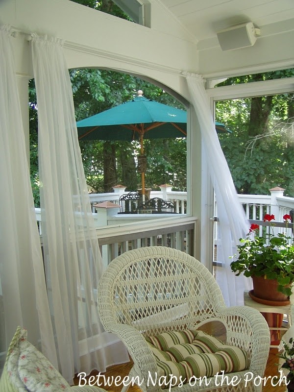 Outdoor speakers installed on a screened porch