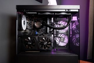 Gaming computer setup with high-end components, peripherals, and ergonomic accessories.