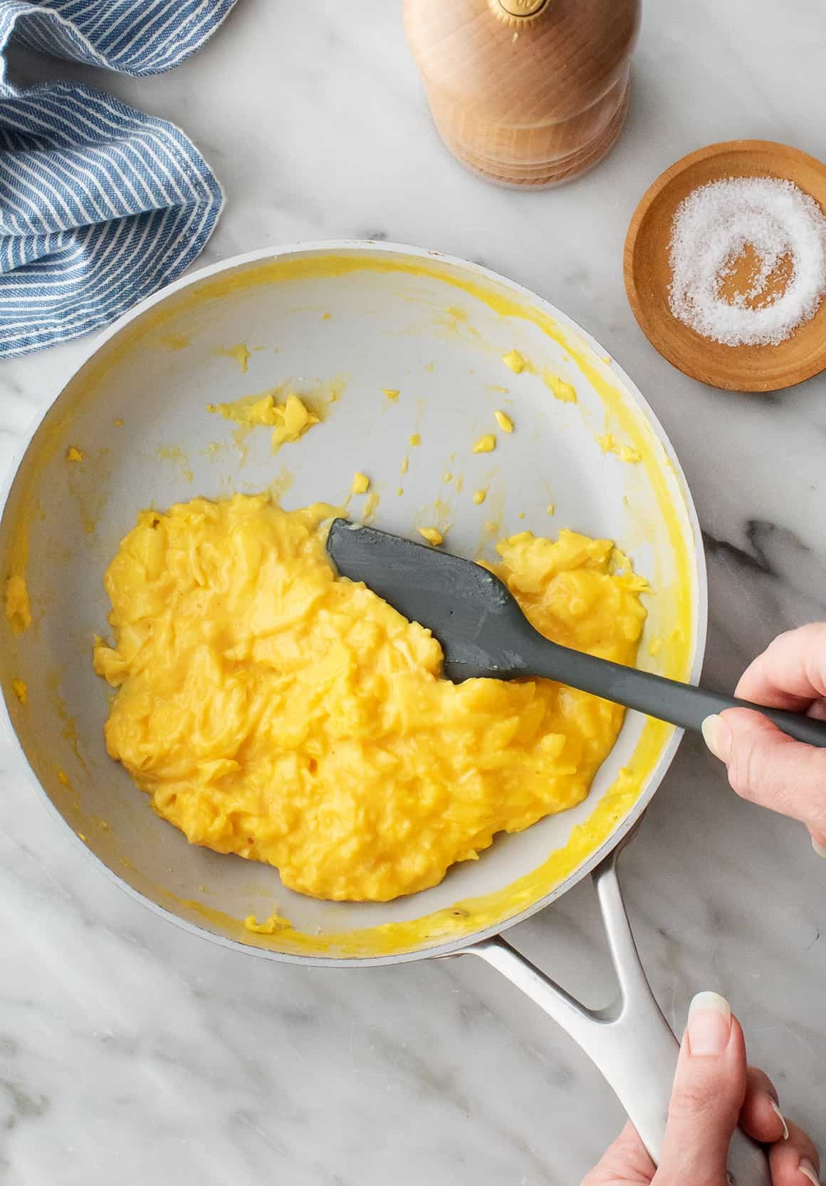 Creamy scrambled eggs in skillet