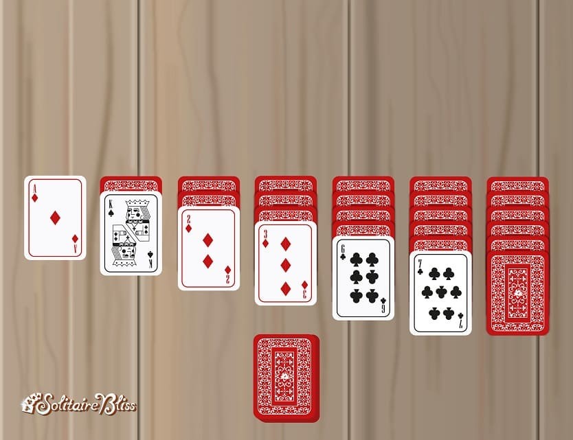 Demonstration of how to deal the sixth row of cards for Solitaire, showing one face-up and one face-down card