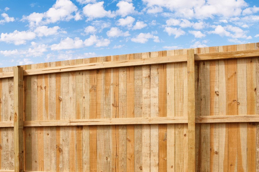 Wooden privacy fence in a backyard
