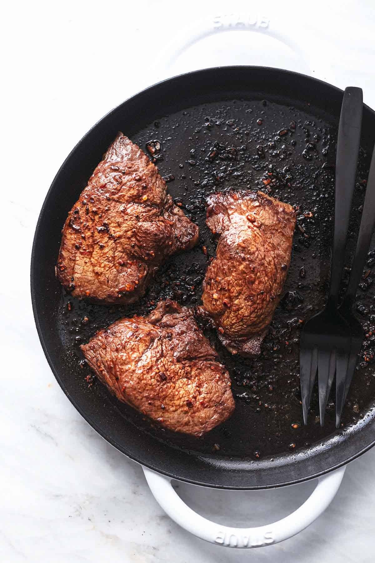 Sirloin steak sliced and topped with butter and herbs