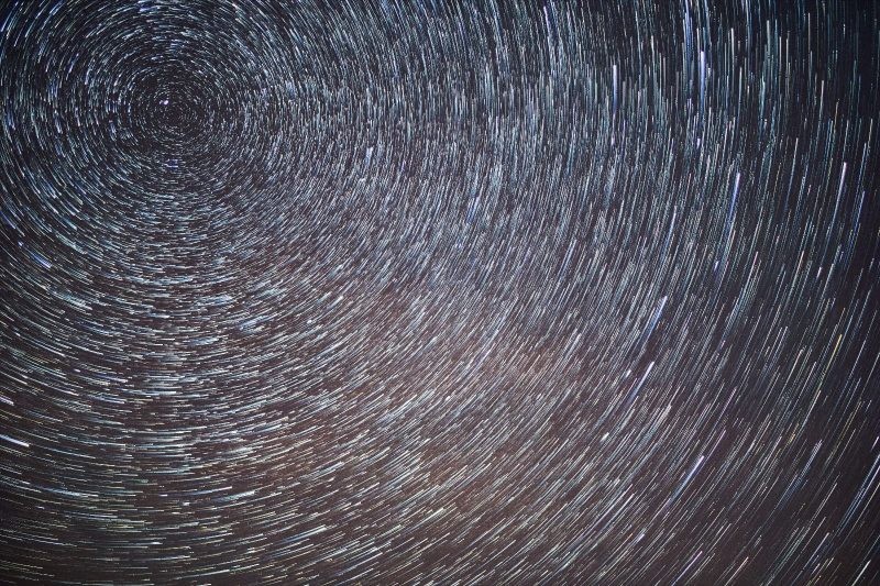 Star trails showing the apparent motion of stars around Polaris.