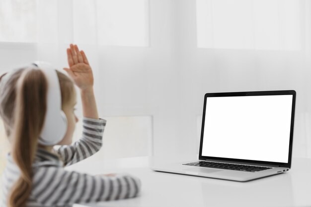 Person using a laptop to search for tablet deals online, emphasizing the importance of research