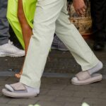 Kanye West wearing Yeezy Slides