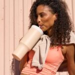 Girl holding an Owala water bottle
